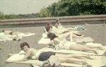 LU-257.190, Sunbathers on roof of Longwood College building 1960