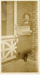 054.002 - Unidentified woman reading Rotunda newspaper. by Longwood University