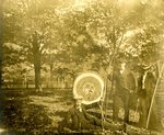 LU-157.0044 - John C. Mattoon (in front of target), Dr. Elmer Jones, and unknown with archery target by John Chester Mattoon