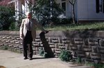 LU-120.839 - Dr. Charles Gordon Moss standing on sidewalk in front of his home