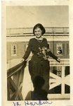 LU-387.017, Woman standing on balcony outside unidentified campus building. Inscribed on bottom margin, "Va. Hardin." by Katherine Krebs