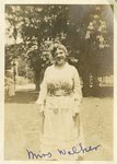 LU-387.018, Woman standing on lawn. Inscribed on bottom margin, "Miss Walker." Likely Addie C. Walker, assistant English instructor. by Katherine Krebs